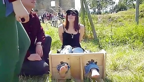 Girl Tied And Tickled Barefoot In The Stocks In Public