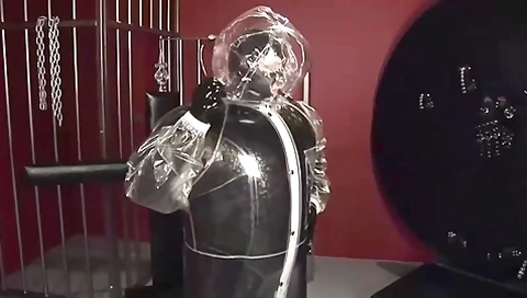 Blonde Girl In Black Latex Catsuit Full Encased In Inflatable Rubber And Full Body Plastic Suit