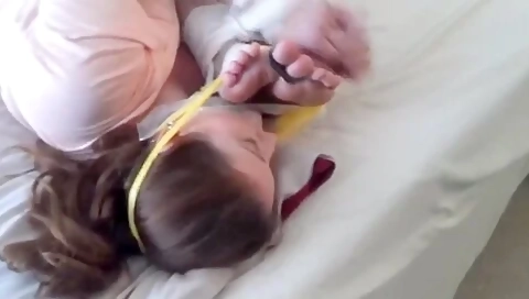 Two Women Tied Together Feet To Face